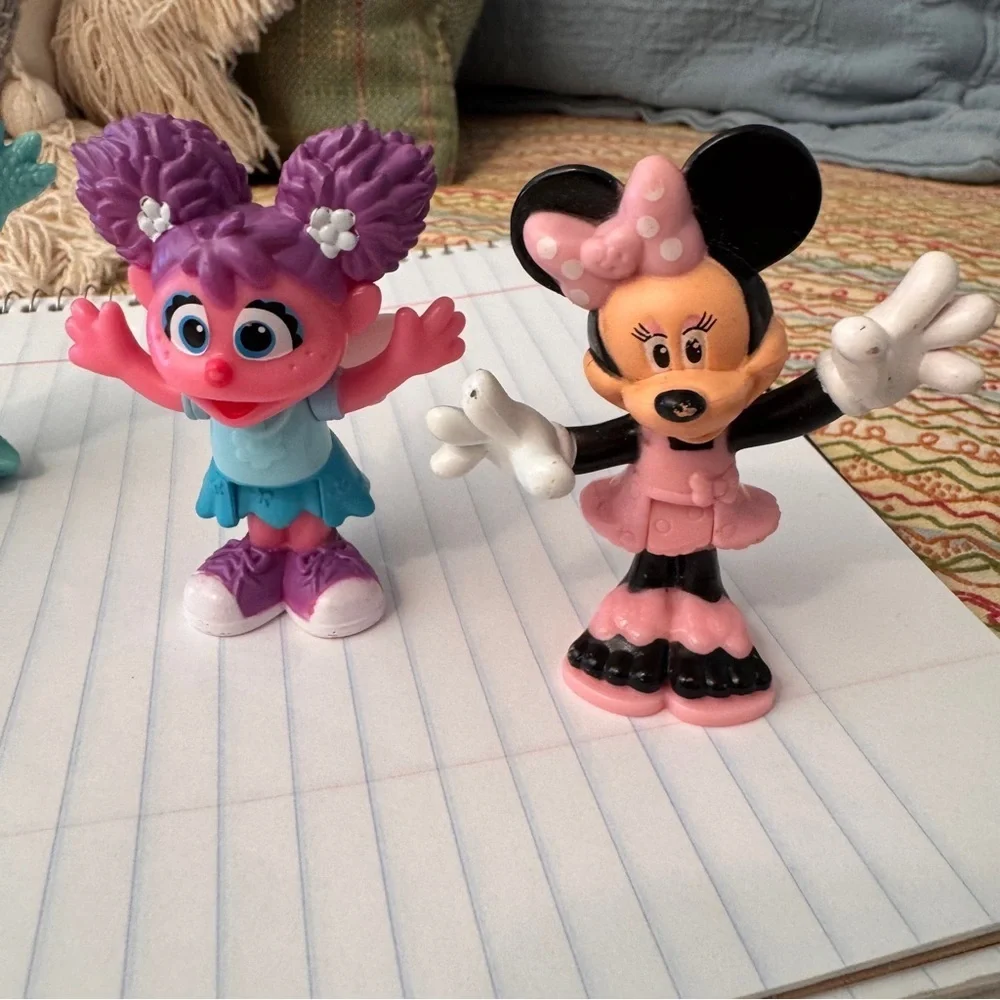 Colorful Sesame Street Neighborhood Friends and Minnie Mouse figurines